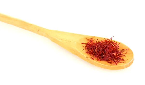 Stigmas of saffron in wooden spoon on white background close-up — Stock Photo, Image