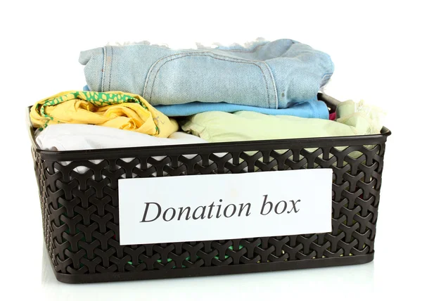 Donation box with clothing isolated on white — Stock Photo, Image