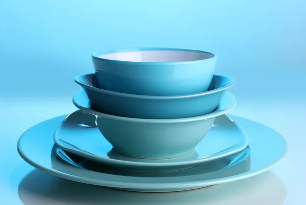 Blue tableware on blue background — Stock Photo, Image