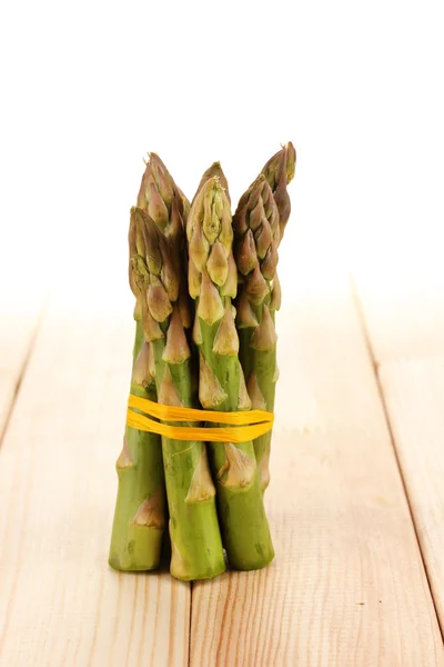 Useful asparagus on wooden table on white background — Stock Photo, Image