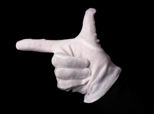 Hand in white glove making sign isolated on black — Stock Photo, Image