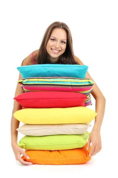 Hermosa joven con almohadas aisladas en blanco — Foto de Stock