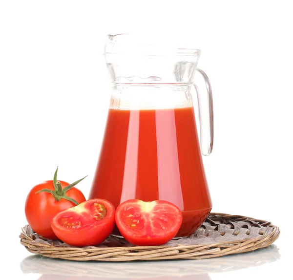 Tomato juice in pitcher on wicker mat isolated on white — Stock Photo, Image