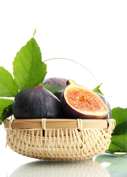 Ripe sweet figs with leaves in basket isolated on white — Stock Photo, Image