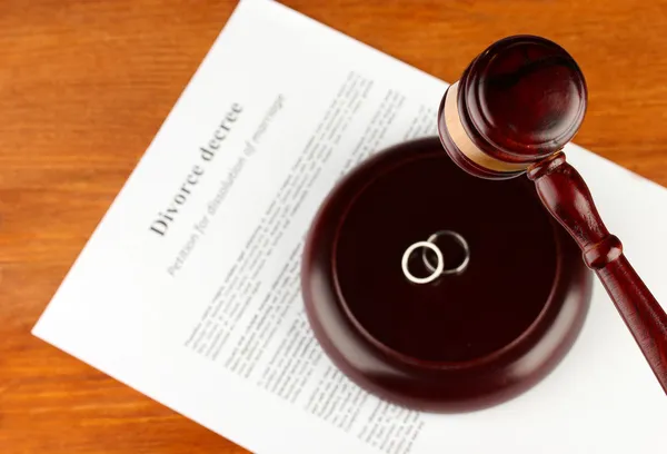 Divorce decree and wooden gavel on wooden background — Stock Photo, Image