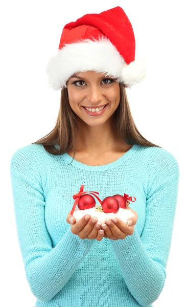 Beautiful young woman holding snow with christmas balls, isolated on white — Stock Photo, Image