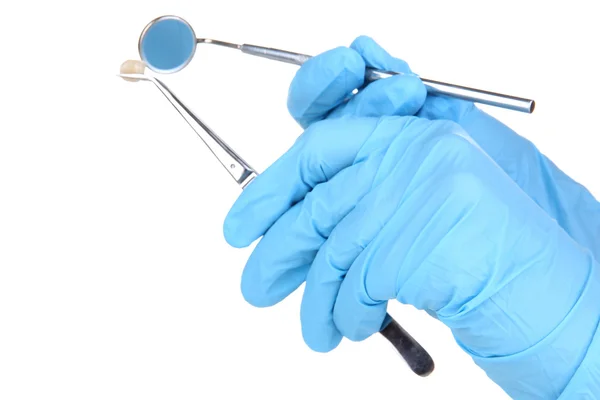 Hands in blue gloves holding dental tools isolated on white — Stock Photo, Image