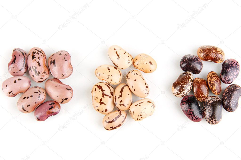 Three hill of beans isolated on white