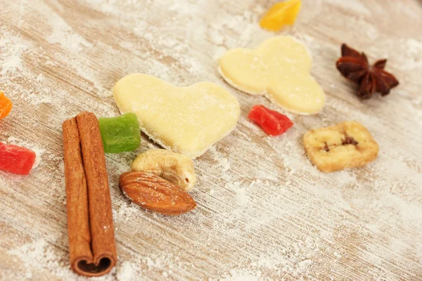 Candied fruit, nuts, unbaked biscuits and molds for cookies — Stock Photo, Image