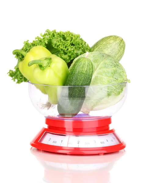 Fresh green vegetables in scales isolated on white — Stock Photo, Image