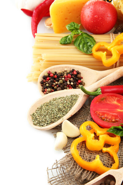 Pasta spaghetti, vegetables and spices, isolated on white