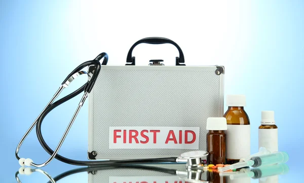 First aid box, on blue background — Stock Photo, Image