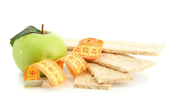 Tasty crispbread, apple and measuring tape, isolated on white — Stock Photo, Image