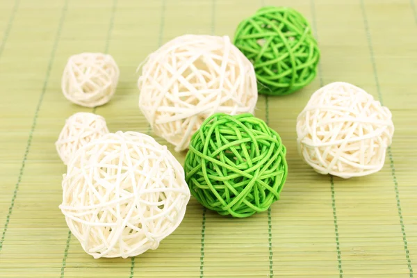 Wicker bamboo balls on bamboo mat — Stock Photo, Image