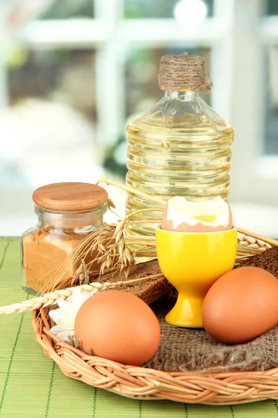 Boiled eggs on wicker matt on bright background — Stock Photo, Image