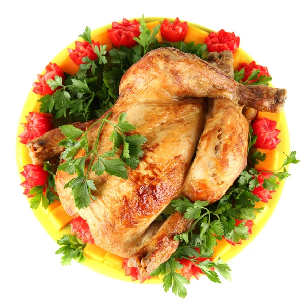 Baked whole chicken with vegetables on a green plate isolated on white — Stock Photo, Image