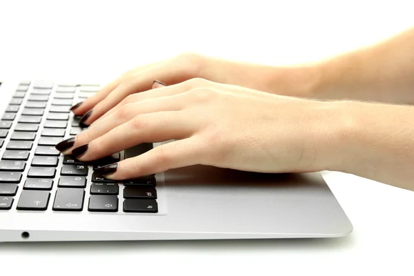 Female hands writing on a white laptot, isolated on white — Stock Photo, Image