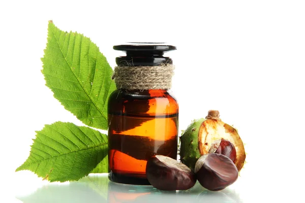 Medicine bottle with chestnuts and leaves, isolated on white — Stock Photo, Image