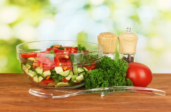 Fresh salad on green background — Stock Photo, Image
