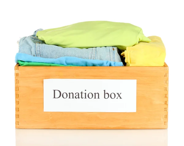 Donation box with clothing isolated on white — Stock Photo, Image