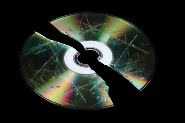 Defective and broken disk with information isolated on black — Stock Photo, Image