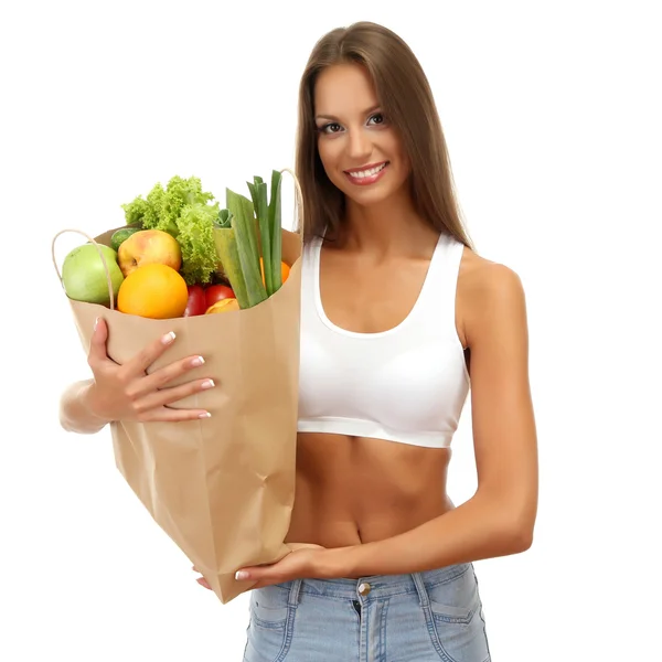 Mooie jonge vrouw met groenten en fruit in boodschappentas, geïsoleerd — Stockfoto