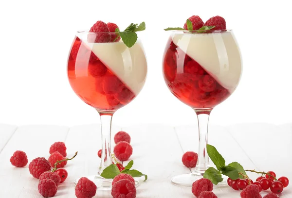 Fruit jelly with berries in glasses on wooden table — Stock Photo, Image