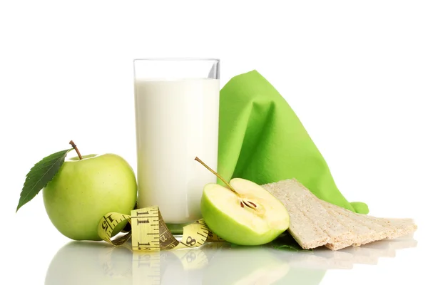 Glass of kefir, green apples, crispbreads and measuring tape — Stock Photo, Image