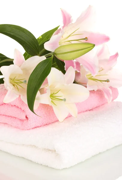 Beautiful lily on towel isolated on white — Stock Photo, Image