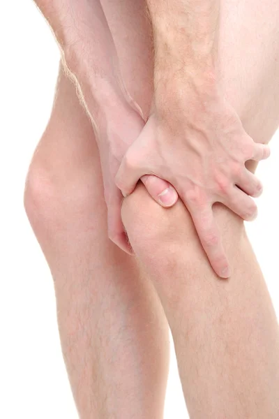 Man holding sore knee, isolated on white — Stock Photo, Image