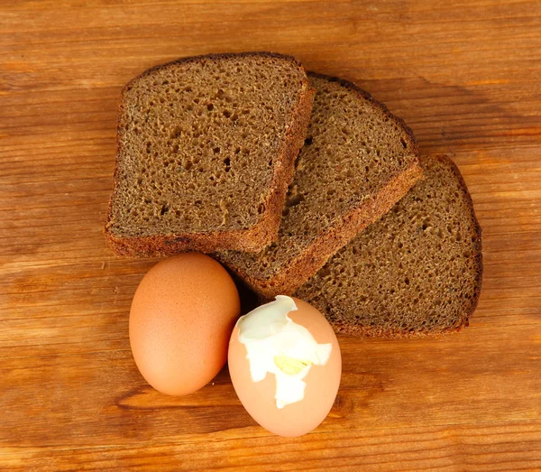 Boiled eggs on wooden background 