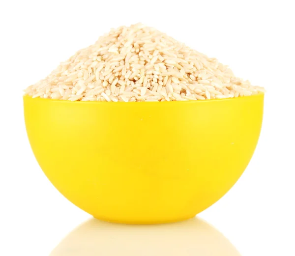 Brown rice in a yellow plate , isolated on white — Stock Photo, Image