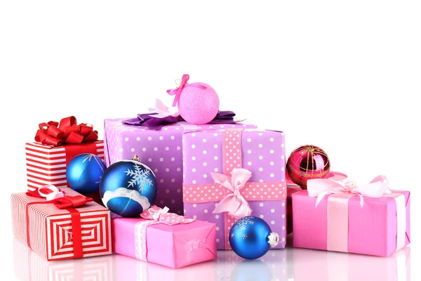 Colorful gifts with Christmas balls isolated on white — Stock Photo, Image