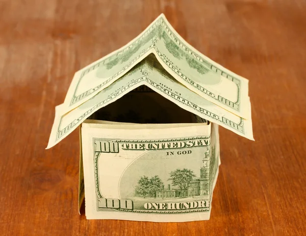 Dollar house on wooden background close-up — Stock Photo, Image