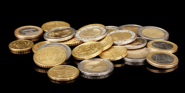 Euro coins isolated on black — Stock Photo, Image