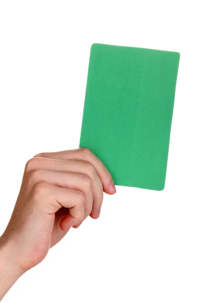 Mão segurando cartão verde isolado no branco — Fotografia de Stock