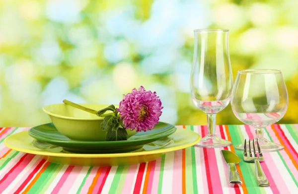 Table setting on bright background close-up — Stockfoto