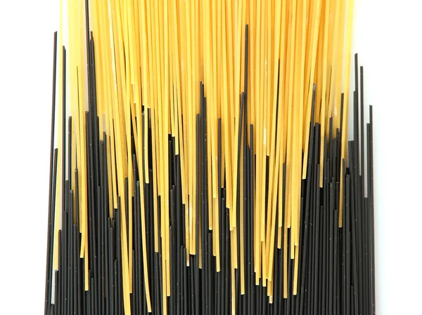Black and yellow spaghetti isolated on white — Stock Photo, Image