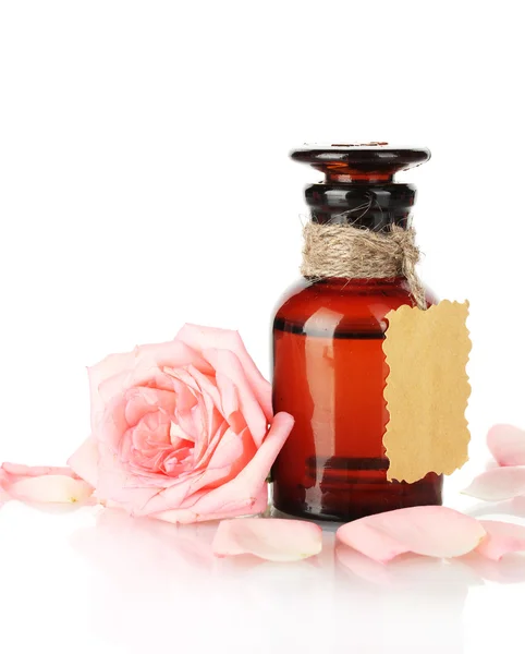 Bottle of oil and rose isolated on white — Stock Photo, Image