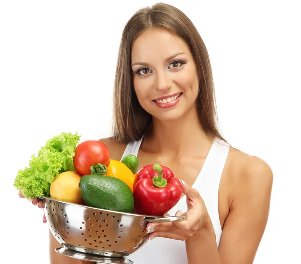 Hermosa mujer joven con verduras en colador, aislado en blanco — Foto de Stock