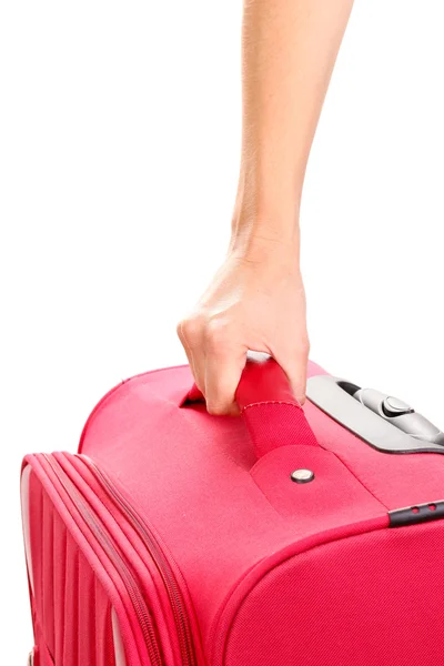 Holding suitcase in hand close-up — Stock Photo, Image