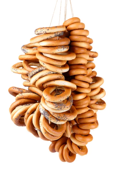 Tasty bagels on rope, isolated on white — Stock Photo, Image