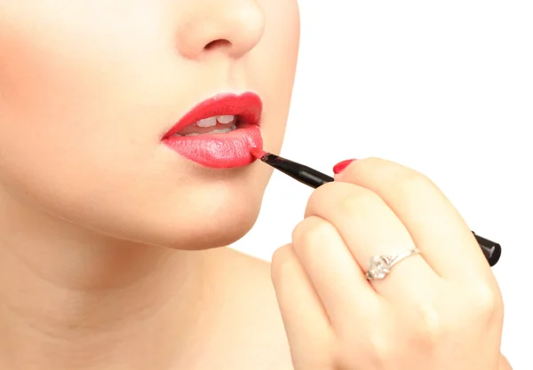 Beautiful woman applying lip gloss — Stock Photo, Image