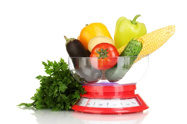 Ripe fresh vegetables in the kitchen scales isolated on white — Stock Photo, Image