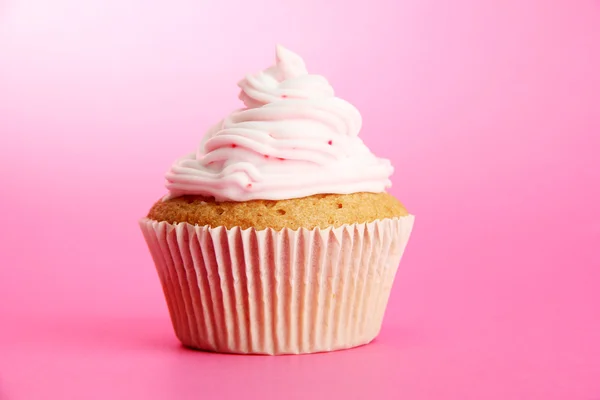 Smakelijke cupcake, op roze achtergrond — Stockfoto