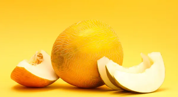 Ripe sweet melons, on yellow background — Stock Photo, Image