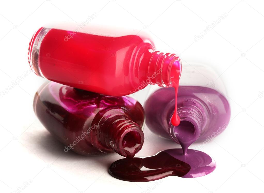 open bottles with bright nail polish isolated on white