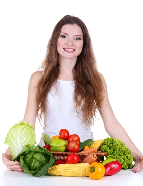 Mulher bonita com legumes na mesa isolada em branco — Fotografia de Stock