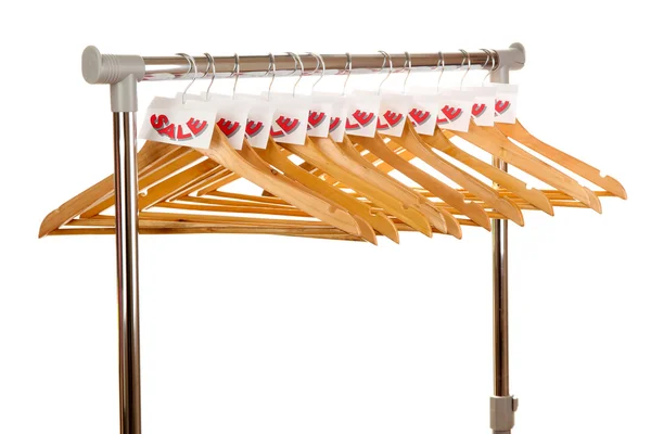 Houten kleerhangers als verkoop symbool geïsoleerd op wit — Stockfoto