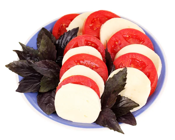 Tasty mozzarella with tomatoes on plate isolated on white — Stock Photo, Image